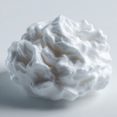 a white ball of whipped cream on a white surface