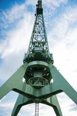 Port cargo crane, close-up, bottom view, vertical photo