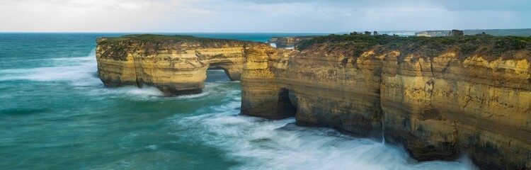 Loch Ard Gorge Natural Limestone Arch with Misty Waves, Great Ocean Road Australia