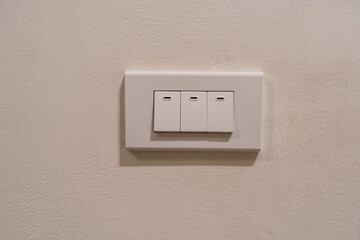 Light switches with plate on white cement