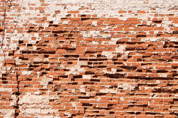 Old battered red brick wall background