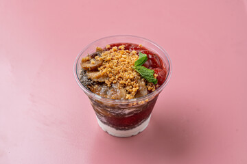 A vibrant dessert cup filled with creamy layers, juicy fruits, and a crunchy topping offers a sweet delight perfect for sharing. This delightful treat brightens up any casual gathering