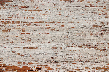 Old battered red brick wall background