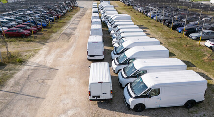 Aerial view of a new delivery vans parking lot at a logistics hub