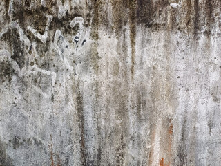 Heavily weathered and stained surface of an old concrete wall, presenting a rich, grunge texture....
