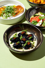 Exquisite dishes arranged harmoniously on a bright green surface, featuring colorful ingredients and diverse textures showcasing modern gastronomy's artistry and innovation