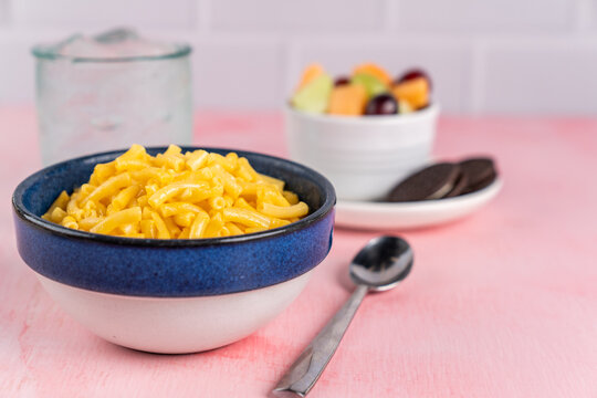 Mac and Cheese with a side of fruit and chocolate sandwich cookies, kids meal 