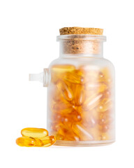 Frosted glass jar with cork lid filled with fish oil capsules and some outside on white background