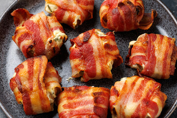 Bacon Wrapped Mushrooms stuffed with garlic cream cheese.