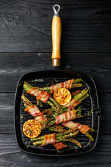 Grilled Bacon Wrapped Asparagus in iron cast pan