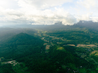 Drone aerial perspective of dense jungle-covered highlands