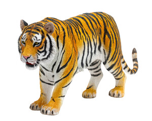 Obraz premium Realistic plastic toy tiger with vibrant orange and black stripes, showcasing intricate details and fierce expression. This wild animal figure is perfect for play or display