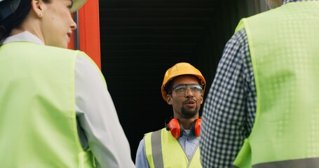 Over the shoulder view of young professional African man worker of freight transportation company...