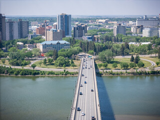 City with a bridge over a river and a lot of cars on the road