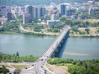 City with a river running through it and a bridge over the water
