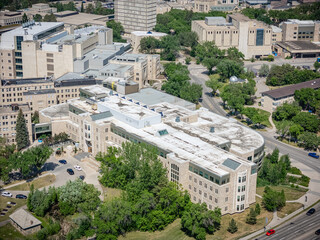 Large building with a lot of windows and a white roof