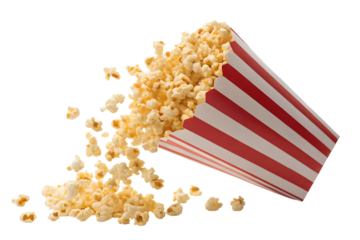 A classic striped red and white popcorn box tilted dramatically, with golden, fluffy popcorn spilling out and scattering mid-air
