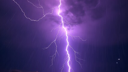 Night sky image of purple lightning