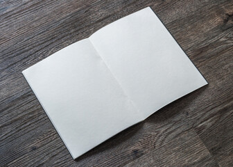 Book mockup with blank opening page a4 paperback mock up for catalog, magazine, menu, booklet, notebook, portfolio design template on wood table background