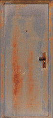 A rusty iron door with a door handle and a peephole.