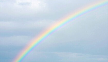 Pastel Rainbow Arch Against Cloudy Sky