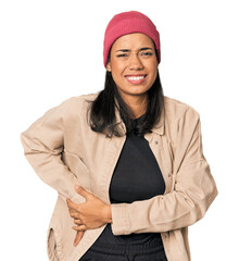 Young Filipino woman in studio having a liver pain, stomach ache.