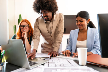 Multiethnic small group of businesspeople meeting in a coworking company office
