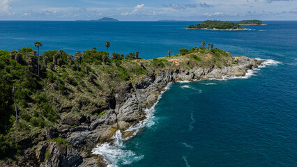 Picturesque small island located in the middle of the vast ocean surrounded by blue waters