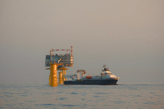 Offshore Substation Platform with Service Vessel in DP Mode During Wind Farm Construction