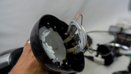 Electric coffee maker disassembled for maintenance