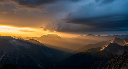 Majestic Mountains Illuminated By Sun Rays Through Dramatic Cloudy Sky
