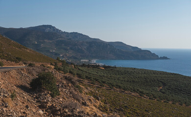 Mediterranean bay during summer evening with steep coastline