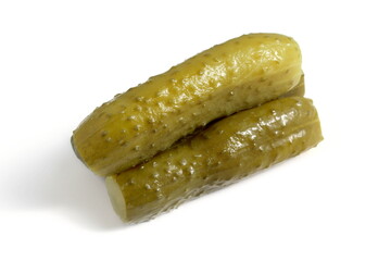 Three pickled cucumbers lie on a white background.