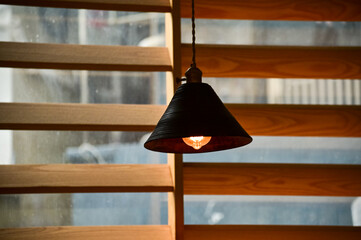 Close-up of the lighting indoors. Light bulb. Interior design, decoration. Lighting equipment.