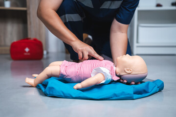 Pediatric First Aid, Two-Finger CPR on Baby Manikin for Emergency Infant CPR Training and...
