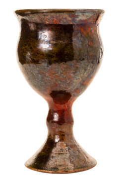 Handcrafted ceramic goblet with glaze isolated on white