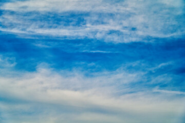 An intentionally soft-focus image of a dramatic sky with evocative clouds, designed as a subtle backdrop for creatives—allowing foreground elements in web or media projects to take center stage