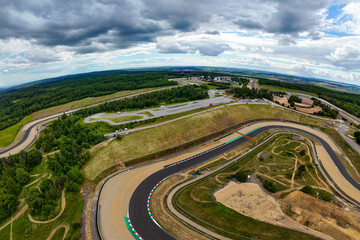 Beautiful drone shot of the race track from above. Automotodrom Brno – Masaryk Circuit....