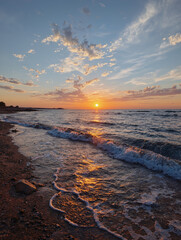 Stunning Sunset Over the Ocean Waves at the Beach