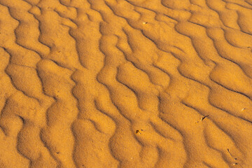 Sands wave texture of desert sand dunes at dusk. 