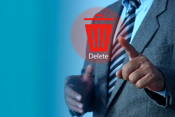 Man pushing the delete button on virtual screen. The concept of deletion or erase contacts, files, informations.