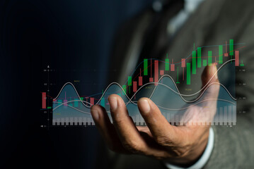 Businessman hand holding economy graph statistic showing growth of profit analyzing financial exchange on increase digital money. stock thread, trading, crypto currency