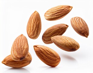 flying almond nuts isolated on white background