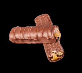 Chocolate bar on black background, abstract food concept