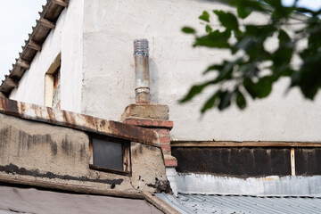 Old brick chimney on the roof