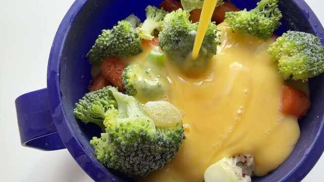 Adding scrambled egg mix to fresh  and frozen vegetables