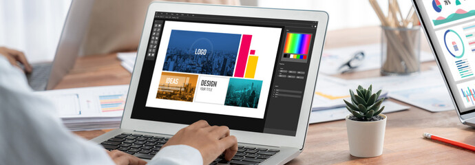Graphic designer software for modern design of web page and commercial brisk ads showing on the...