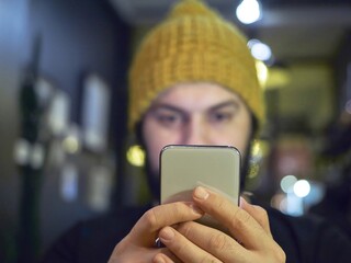 young woman texting on mobile phone
