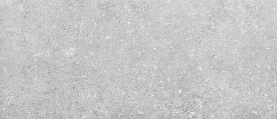 A gray and white wall with a lot of texture. wall is made of concrete and has a rough surface industrial concept background.