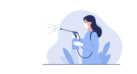 Woman spraying disinfectant mist while wearing a mask in blue outfit  